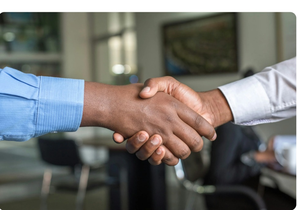 Professional handshake between student advisor and client
